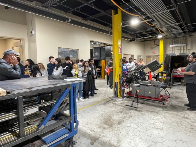 Students taking a tour in the machining, welding, and 3-d printing areas. 